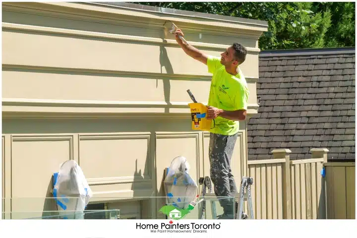 painter on high ladder