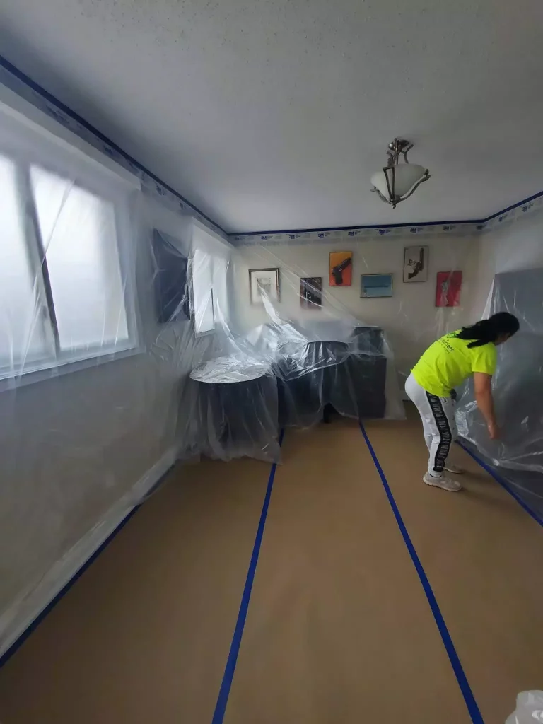 painters preparing room for paint