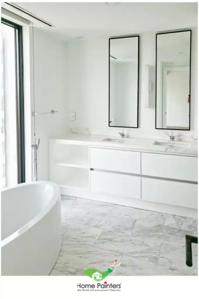 Interior Painting Bathroom White Condominium Bathroom with Black Accents and Marble Floors and Counters
