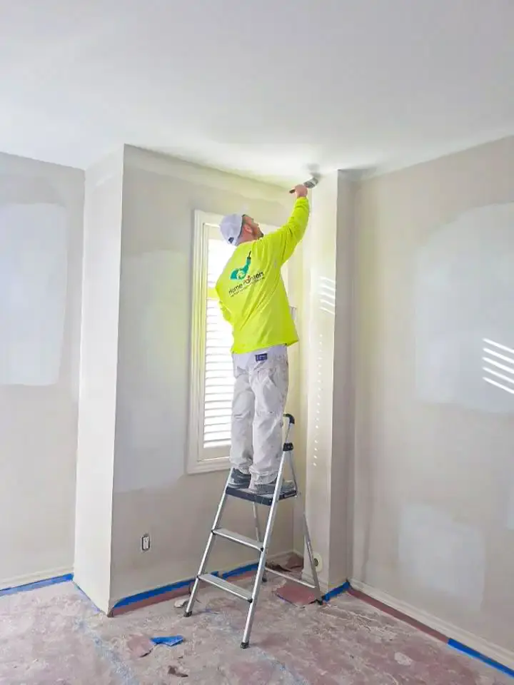 painter painting with step ladder home painters toronto