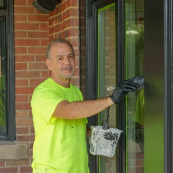 painter painting glass
