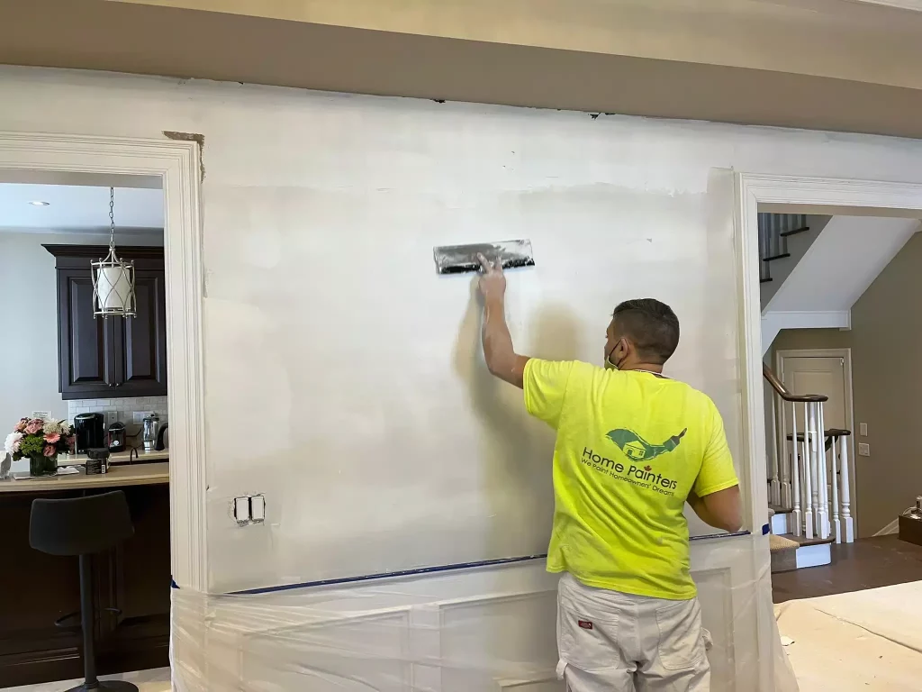 priming wall by painters