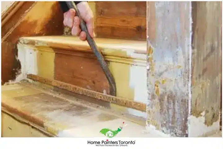 painter repairing wooden step