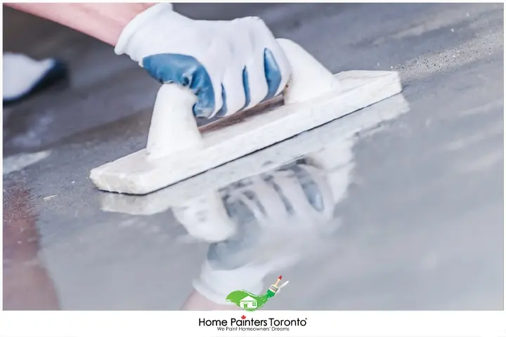 painter sealing concrete floor