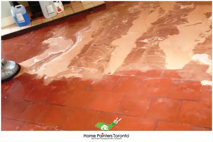 painter removing efflorescence on the floor