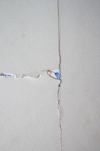 Drywall joint tape loose, professionally done drywall repairing by house painters from home painters toronto in a house, drywall damage, how to skim coat drywall after wallpaper removal, pin holes in drywall, drywall repair, how to fix drywall