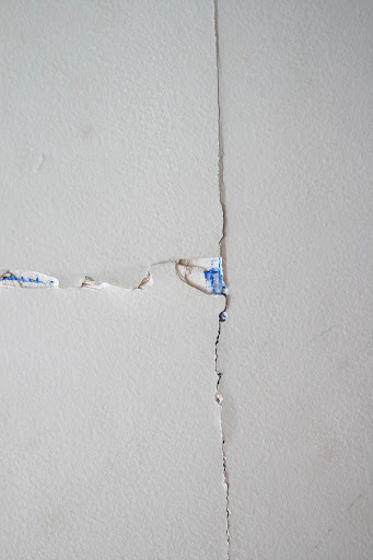 Drywall joint tape loose, professionally done drywall repairing by house painters from home painters toronto in a house, drywall damage, how to skim coat drywall after wallpaper removal, pin holes in drywall, drywall repair, how to fix drywall