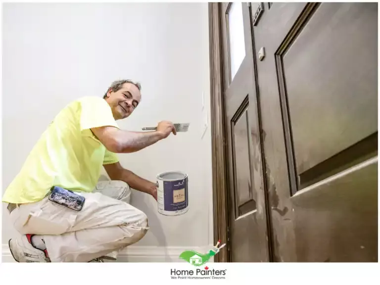painter painting interior with brush
