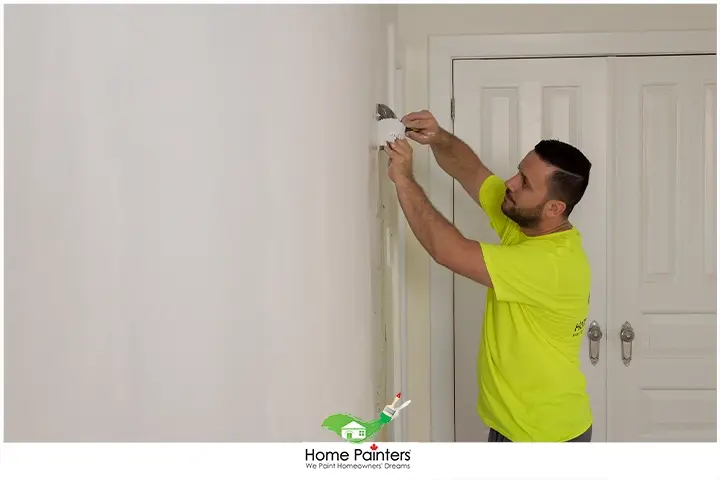 Painter Repairing Drywall