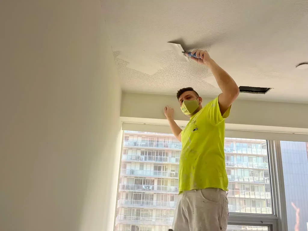 flattening stucco ceiling by painters