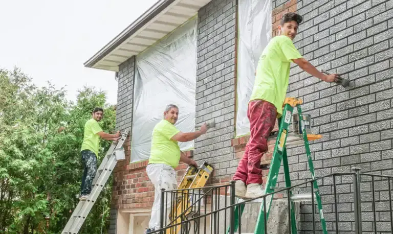 painters painting exterior bricks