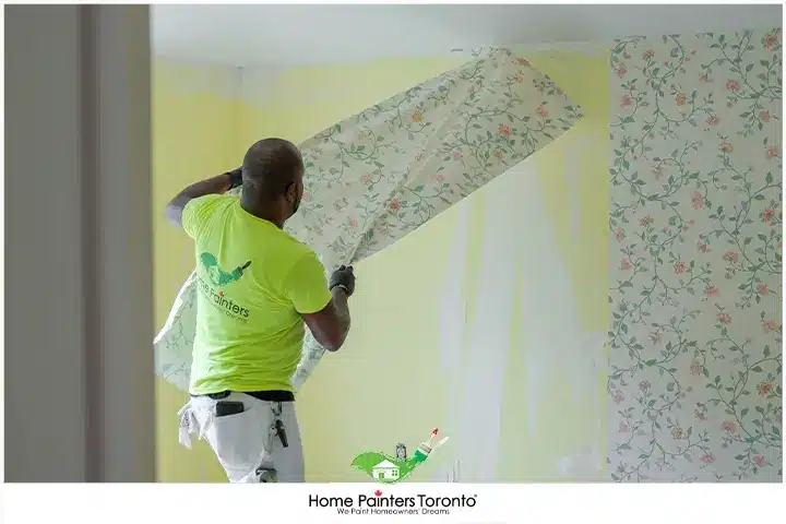 Painter Removing Wallpaper