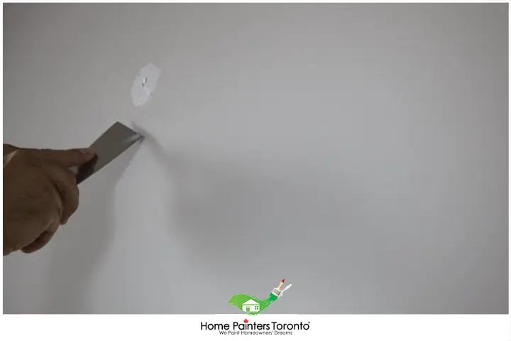 Painter Repairing Small Holes on Walls