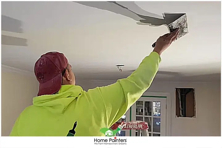 Painter Repairing Stucco Ceiling