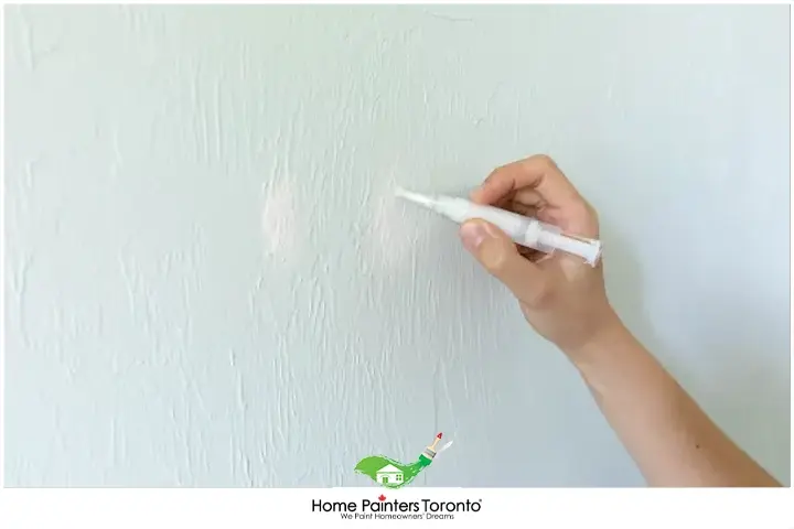 Painter Using Paint Pen on Walls