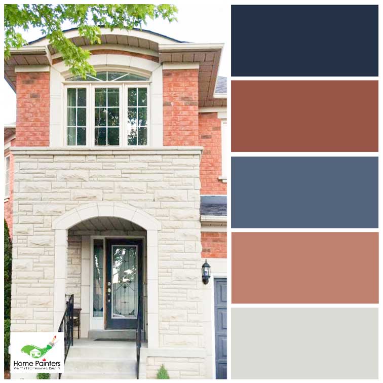 red brick house with stone wall accents and wood door painted navy blue to maximize curb appeal house painters in toronto