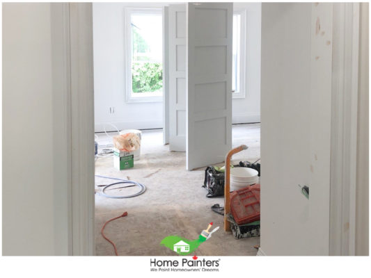 empty room with painted white doors and tools on ground, professional painters, interior house painters, interior painting company, toronto house painters, home painting services