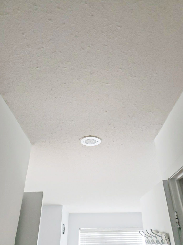 white hallway with stucco ceiling