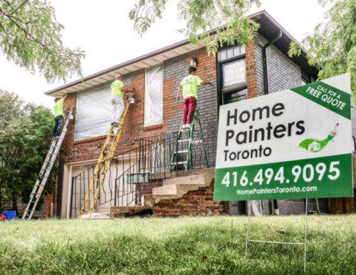 Professional Painters from Home Painters staining bricks for exterior house using ladder, brick staining project, how often should a house be painted, exterior house painters, exterior painting toronto, brick painters, is it worth paying someone to paint your house