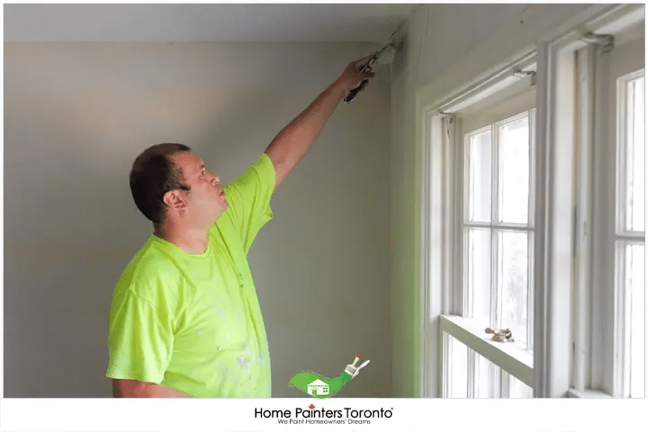 Painter Plastering The Wall