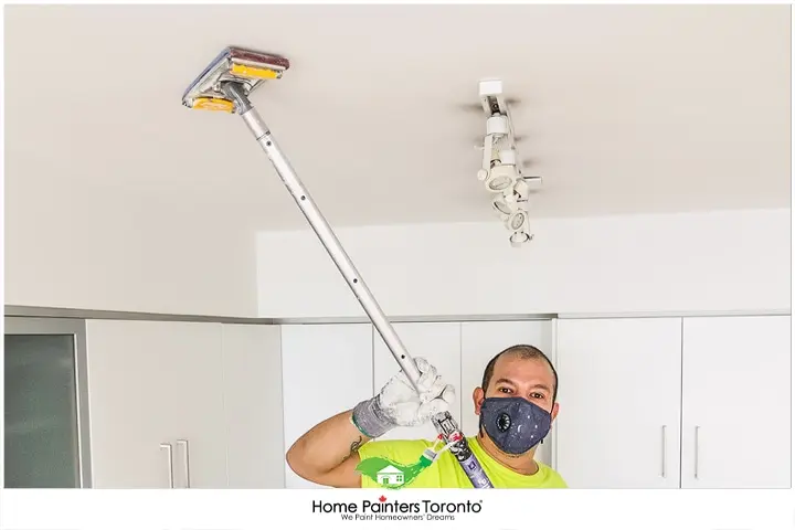 Painter Repairing Ceiling