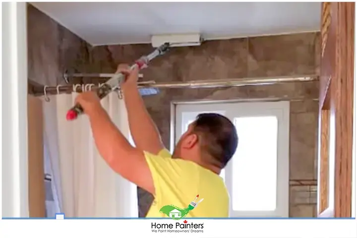 Painter Painting Bathroom Ceiling