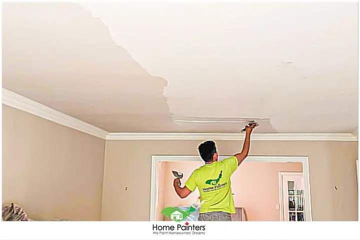 Painter Painting Ceiling of A Bedroom or Hallway