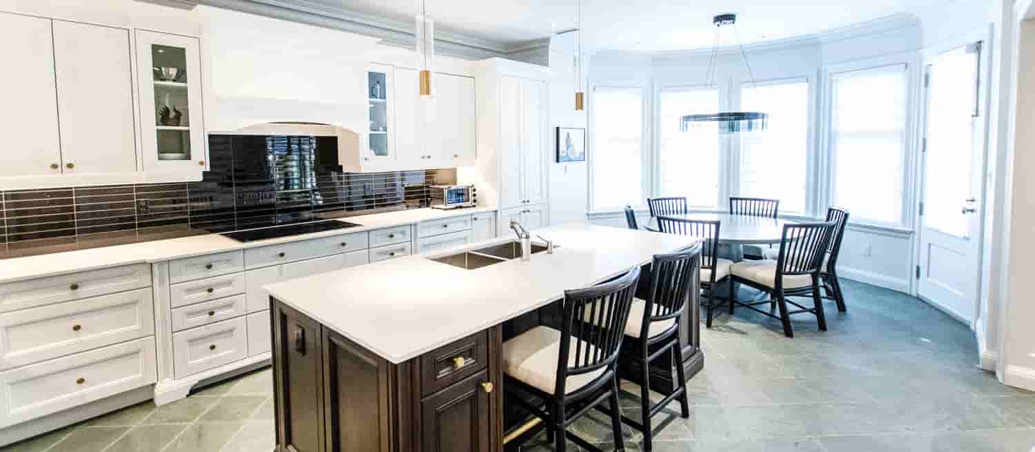 Kitchen cabinet painting job of white cabinets in a modern and classic kitchen by home painters toronto