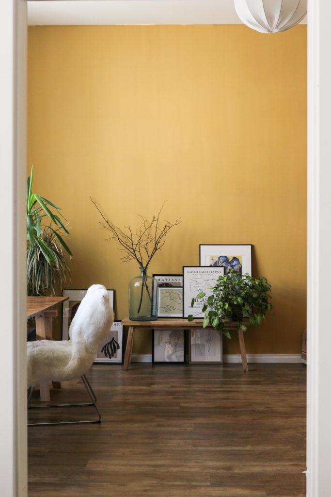 illuminating yellow accent wall in dining room painters in toronto