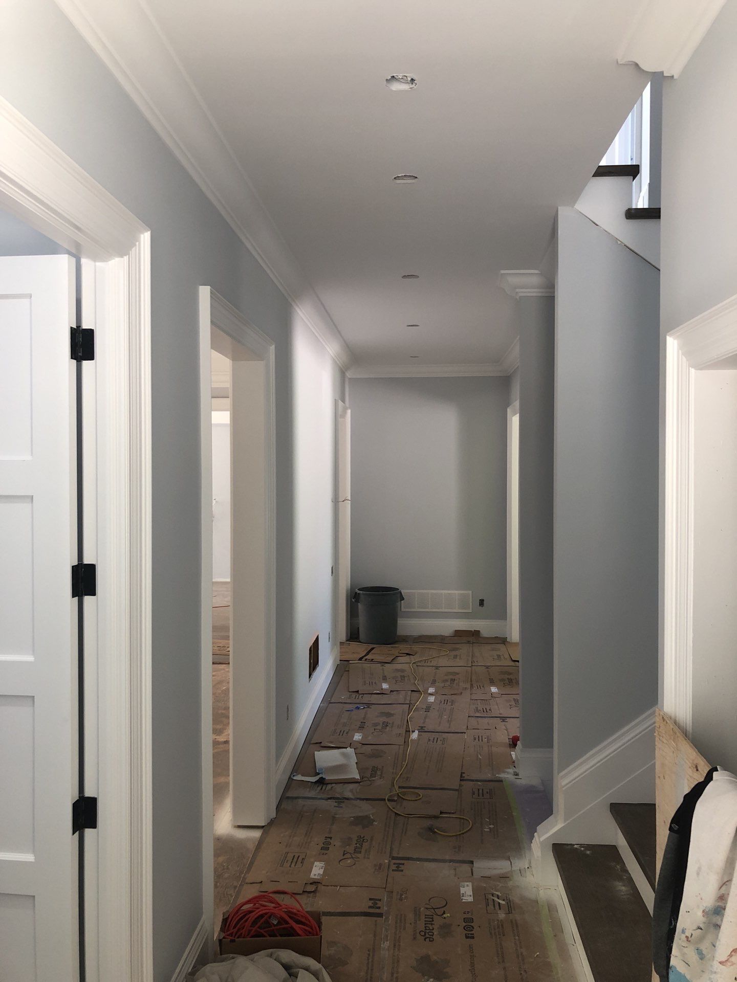 Interior Painting_Drywall Installation_White_Unfinished Hallway, Uninstalled Doors and Drywall