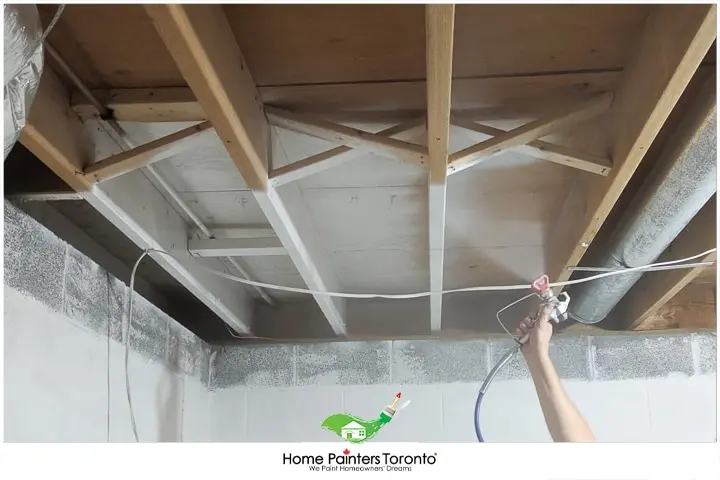 painter painting basement ceiling