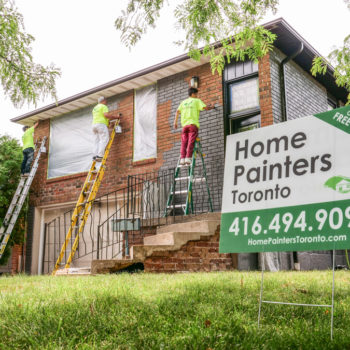 Exterior brick staining painters working on ladders home painters toronto