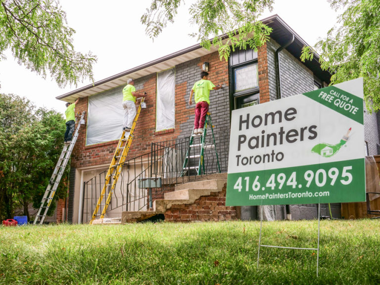 Exterior brick staining painters working on ladders home painters toronto