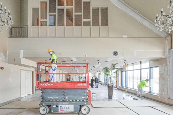 Commercial-Painting_Worker-On-Lift-Painting-Ceiling - Professional Home Painting Services