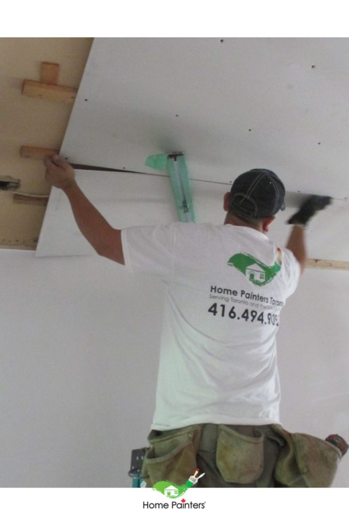 Painter repairing drywall