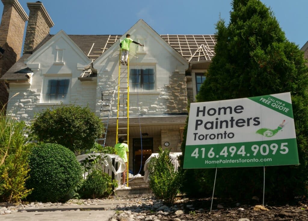 Exterior Painting Brick Painting Light Grey Full View of Workers on Ladders Painting Stone House