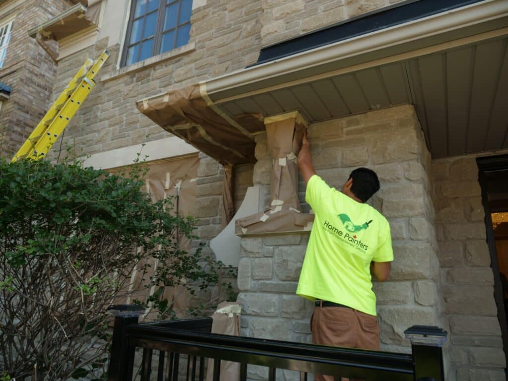 Exterior Painting Brick Staining Light Grey Male Painter Prepping Stone House for Painting