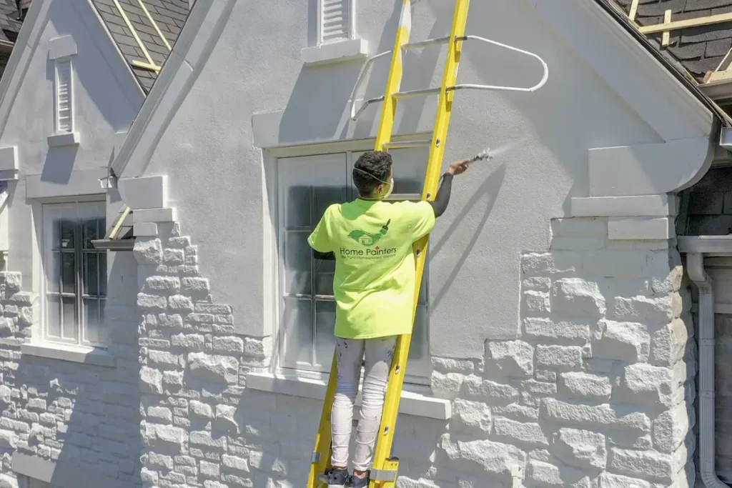 Spray Painting Brick on Ladder
