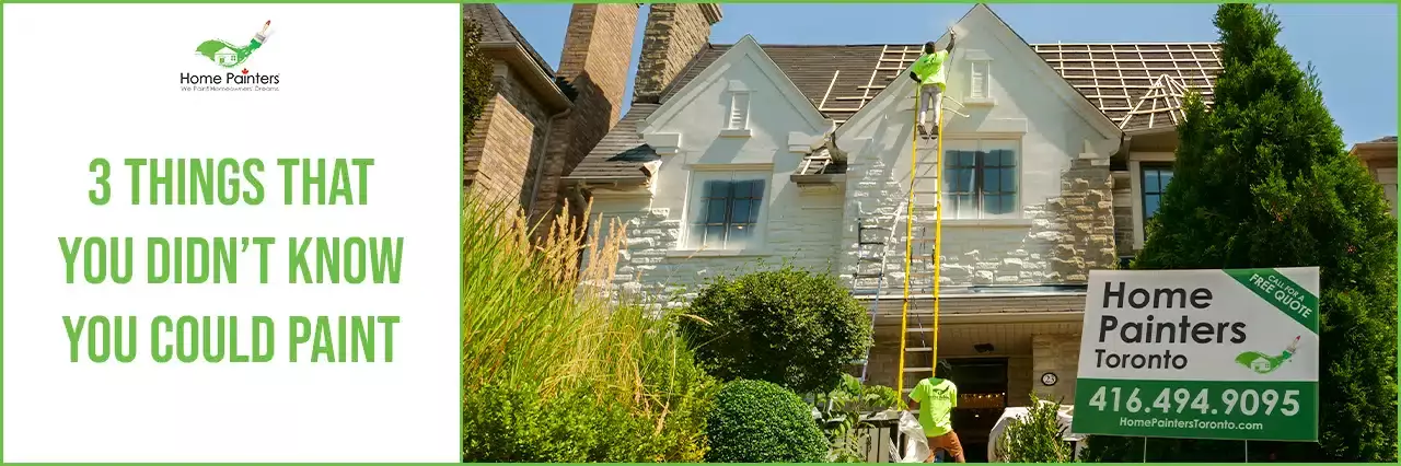 Painter painting exterior bricks
