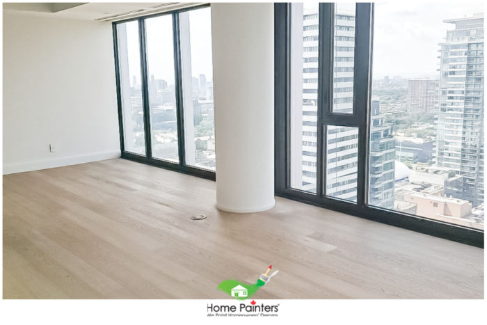 Interior-Painting_Condominum-Painting_white_livingroom-with-white-walls-with-large-window-overlooking-the-city-e1597929445311