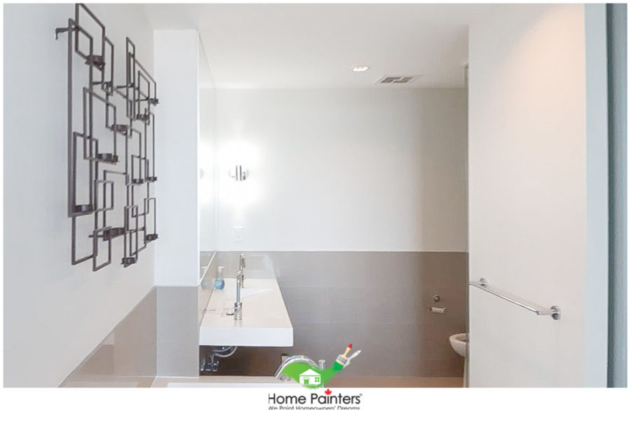 interior-painting_bathroom_white_condominium-bathroom-with-grey-accent-wall-and-silver-appliances-e1597929573784