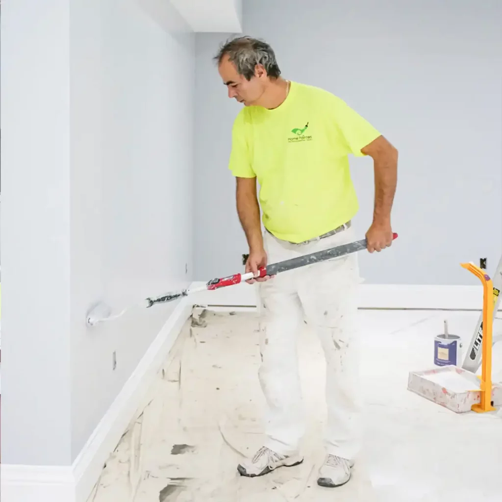 Interior painter from interior painting company Home painters toronto in mississauga working passionately on Home interior colour project, interior painting services, interior painting toronto, is it worth paying someone to paint your house