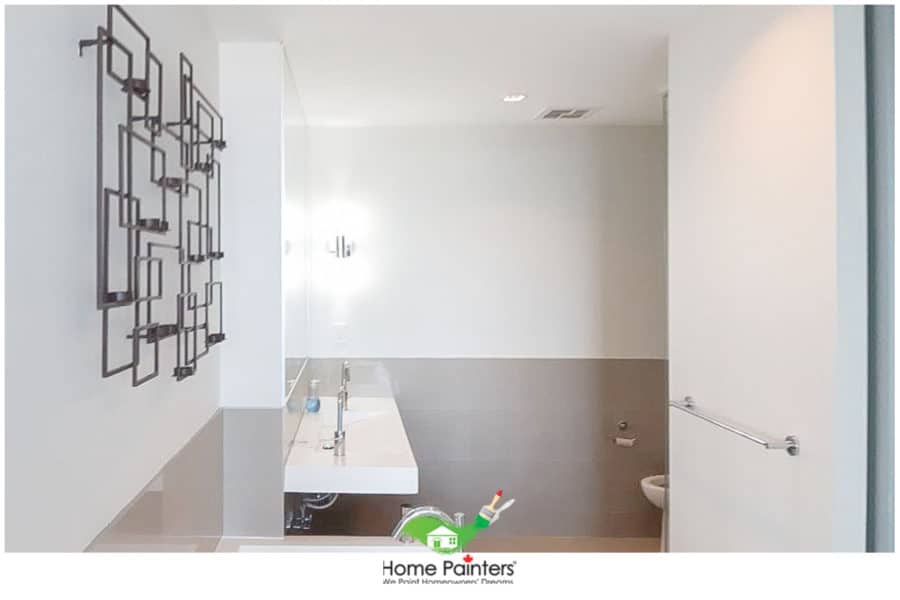interior-painting_bathroom_white_condominium-bathroom-with-grey-accent-wall-and-silver-appliances
