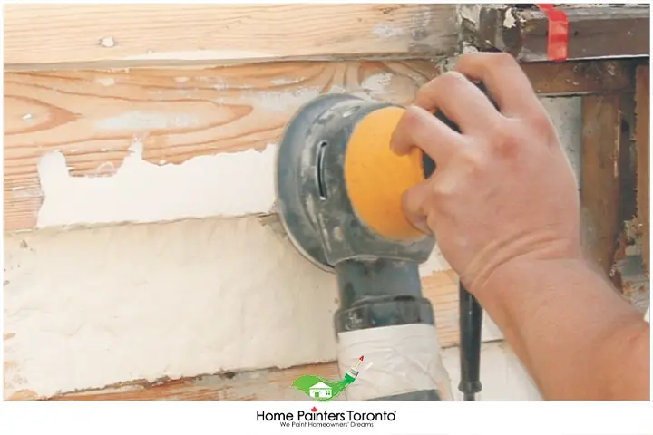 painter filling wood filler or epoxy