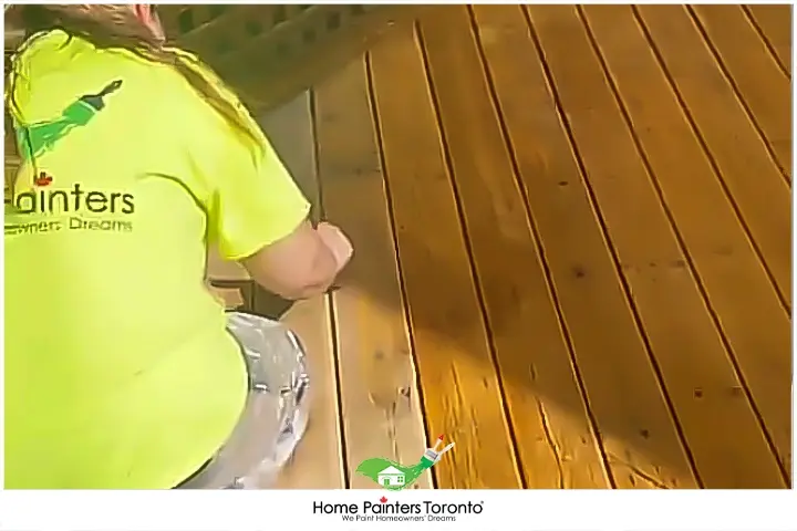 painters repairing or staining a deck