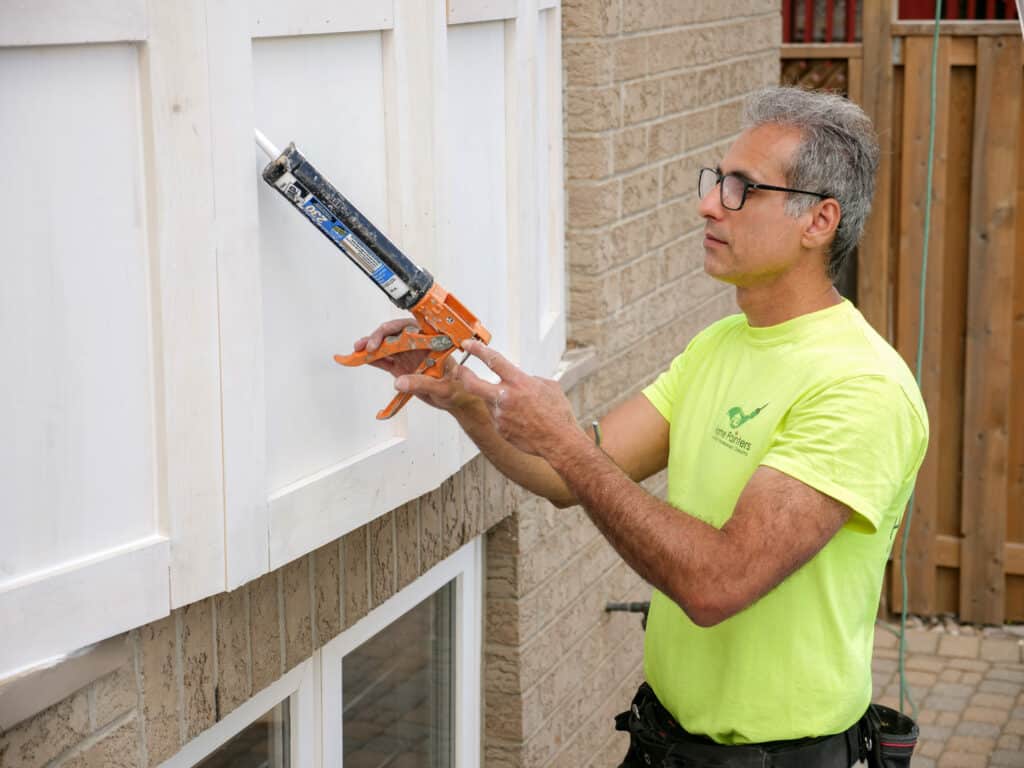 Painter Caulking Wood Siding