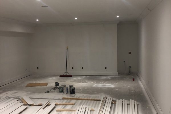 White unfinished basement with trim on the floor