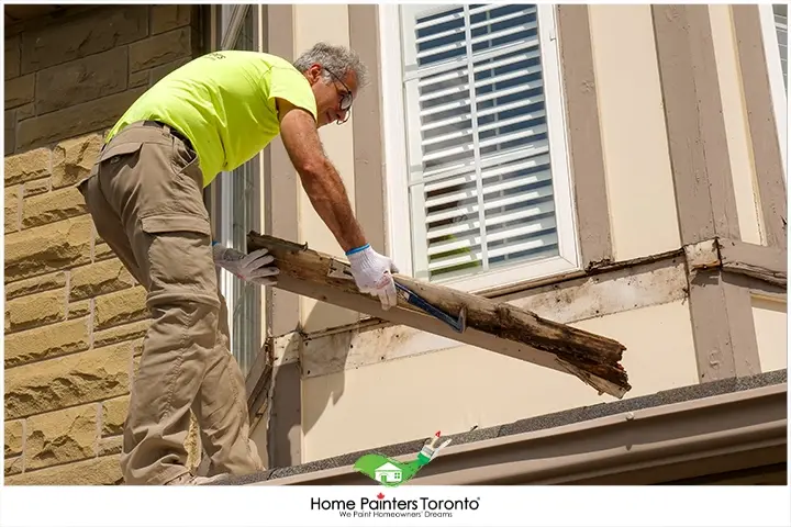 painter-repairing-a-wood-window
