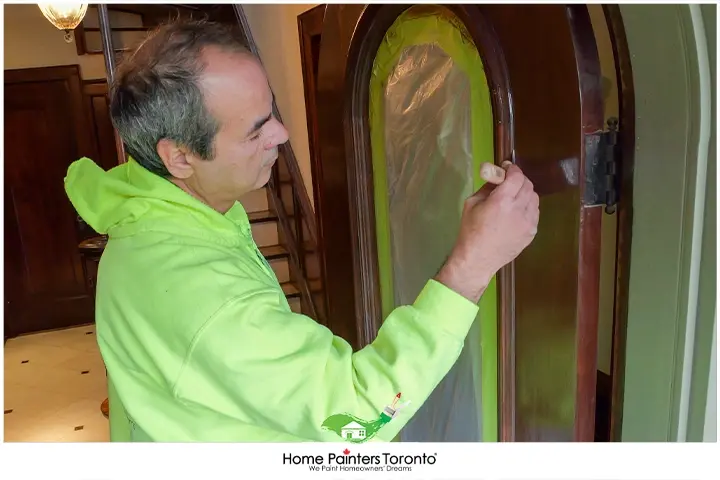 painter painting a door