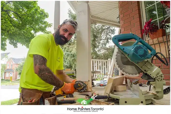 Painter Looking at a camera while working